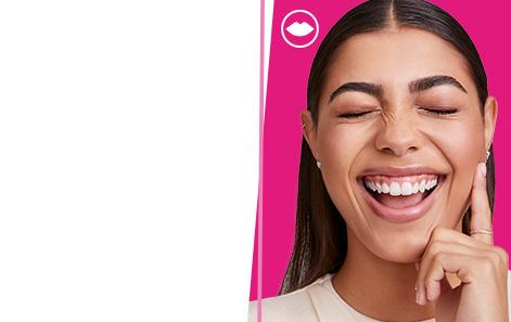 Smiling model wearing Mary Kay® color products on a hot pink background.  